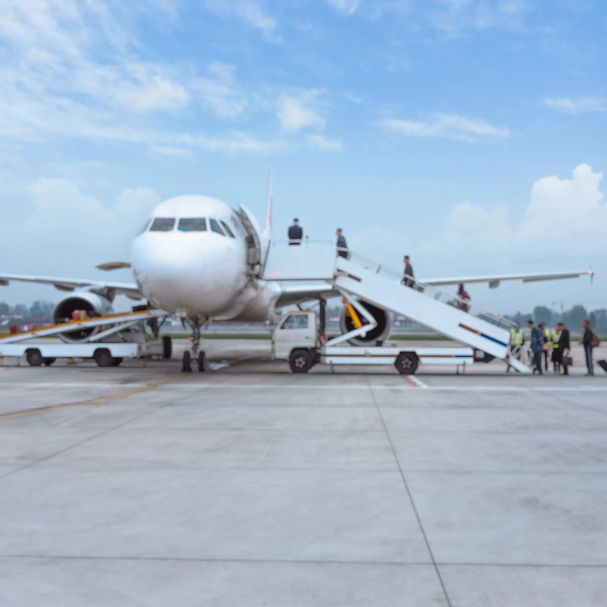 people boarding airplane runway min 1 scaled